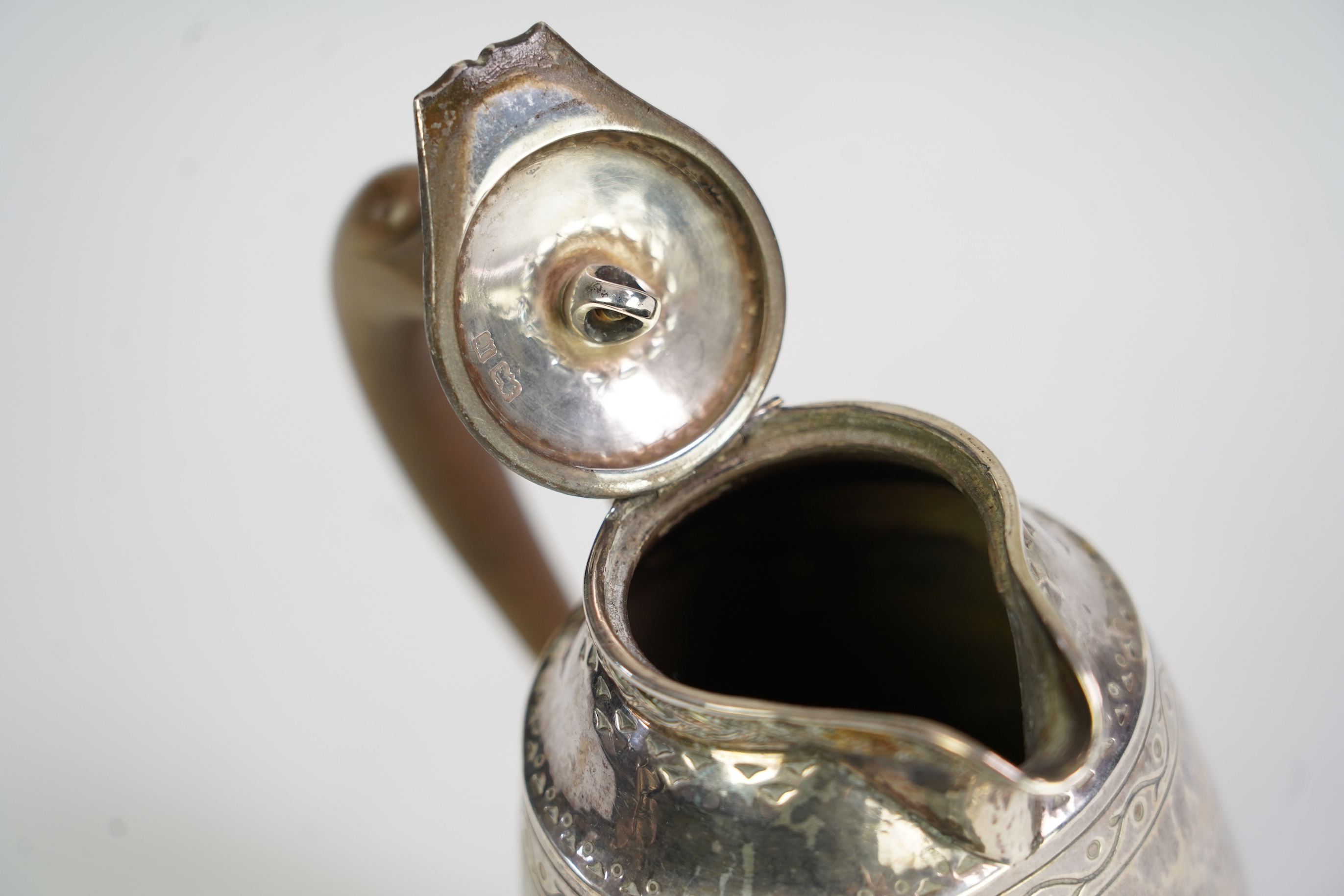 A George V Arts & Crafts silver hot water pot by Liberty & Co